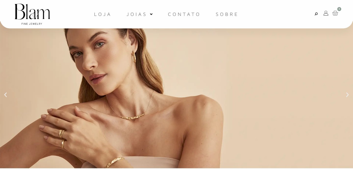 Blam home page: serif wordmark, spaced-out navigation and a campaign photo of a woman wearing gold jewelry